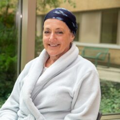 A woman in a robe and head covering